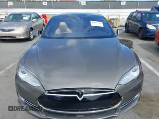 2015 Tesla Model S 85 with VIN 5YJSA1E14FF120455, listed as a IAAI auction lot 42053306 with 62,817 mi miles and . Bid and sale history available at DreamBid. Image 12.