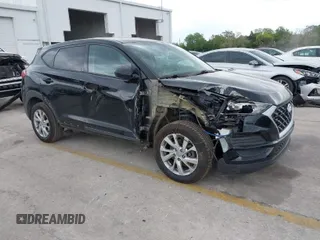 2019 Hyundai Tucson SE with VIN KM8J23A40KU874423, listed as a IAAI auction lot 41858253 with 136,651 mi miles. Bid and sale history available at carsss.com. Image 1.