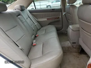 2004 Toyota Camry LE z VIN JTDBE32K440281087, wystawiony jako Copart lot #60486995 z przebiegiem 229 856 mil mil oraz Czysty tytuł • Clean title. Historia ofert i sprzedaży dostępna na DreamBid. Obrazek 11.
