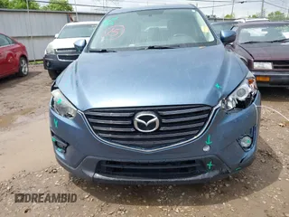 2016 Mazda CX-5 Touring z VIN JM3KE2CY3G0728968, wystawiony jako IAAI lot #42189174 z przebiegiem 145 977 mil mil oraz . Historia ofert i sprzedaży dostępna na DreamBid. Obrazek 13.