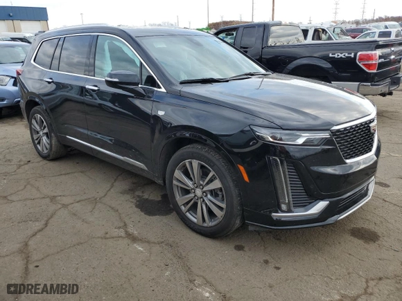 2021 Cadillac XT6 Premium Luxury with VIN 1GYKPDRSXMZ179742, listed as a Copart auction lot 79511814 with 33,895 mi miles and Salvage Title. Bid and sale history available at carsss.com. Image 4.