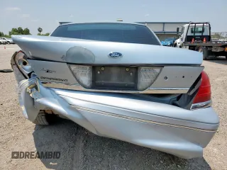 2004 Ford Crown Victoria LX z VIN 2FAFP74W54X184815, wystawiony jako Copart lot #57280725 z przebiegiem 294 513 mil mil oraz Szkoda całkowita • Salvage title. Historia ofert i sprzedaży dostępna na DreamBid. Obrazek 6.