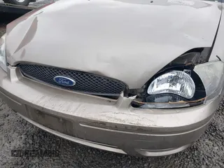 2006 Ford Taurus SE z VIN 1FAFP53U26A197294, wystawiony jako IAAI lot #41506334 z przebiegiem 180 411 mil mil oraz . Historia ofert i sprzedaży dostępna na DreamBid. Obrazek 6.