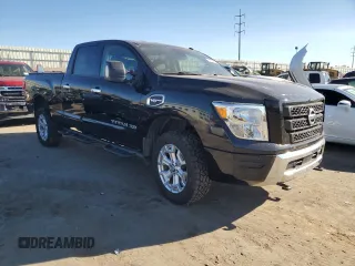 2021 Nissan Titan XD SV with VIN 1N6AA1FB9MN517657, listed as a Copart auction lot 79363644 with 100,628 mi miles and Salvage Title. Bid and sale history available at carsss.com. Image 4.