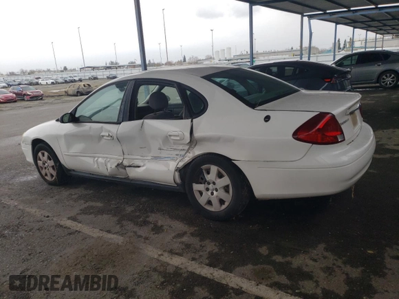2003 Ford Taurus LX Standard with VIN 1FAFP52U53G280700, listed as a Copart auction lot 87488014 with 128,020 mi miles and Salvage title. Bid and sale history available at DreamBid. Image 2.