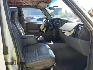 1998 Jeep Cherokee Sport with VIN 1J4FJ68S4WL227094, listed as a IAAI auction lot 42361950 with Not provided miles and . Bid and sale history available at DreamBid. Image 5.