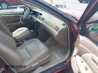 2000 Toyota Camry CE z VIN JT2BG22K3Y0521541, wystawiony jako IAAI lot #42074772 z przebiegiem 144 587 mil mil oraz . Historia ofert i sprzedaży dostępna na DreamBid. Obrazek 5.
