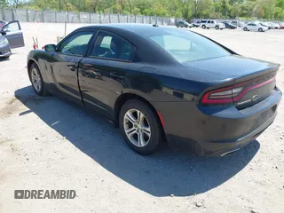 2015 Dodge Charger SE with VIN 2C3CDXBG9FH790573, listed as a IAAI auction lot 42142908 with 195,182 mi miles and . Bid and sale history available at carsss.com. Image 3.