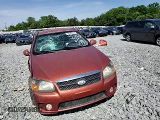 2009 Kia Spectra SX z VIN KNAFE221095025989, wystawiony jako Copart lot #57583155 z przebiegiem 261 776 mil mil oraz Szkoda całkowita • Salvage title. Historia ofert i sprzedaży dostępna na DreamBid. Obrazek 13.