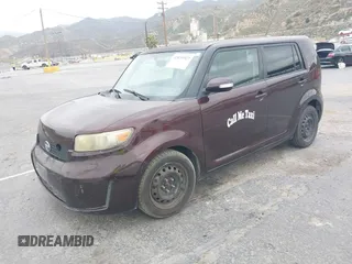2009 Scion xB with VIN JTLKE50E291081243, listed as a IAAI auction lot 42033327 with 263,903 mi miles. Bid and sale history available at carsss.com. Image 2.