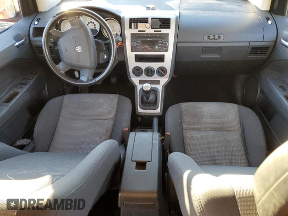2009 Dodge Caliber SXT with VIN 1B3HB48C99D144317, listed as a Copart auction lot 79491144 with Not Provided miles and Salvage Title. Bid and sale history available at DreamBid. Image 8.