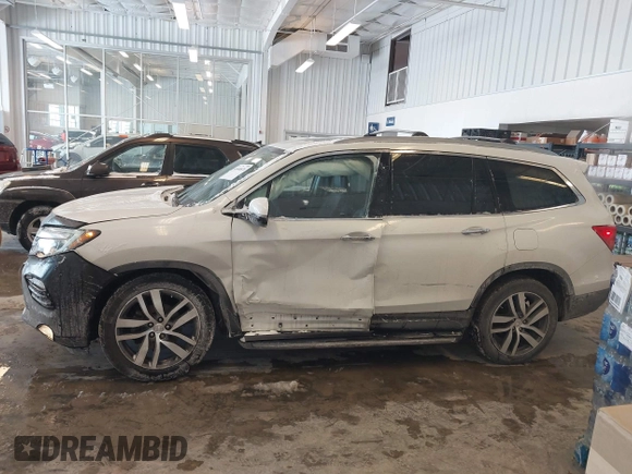 2017 Honda Pilot Touring with VIN 5FNYF6H92HB032873, listed as a IAAI auction lot 41608870 with 123,888 mi miles. Bid and sale history available at carsss.com. Image 14.