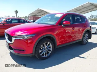 2021 Mazda CX-5 Grand Touring with VIN JM3KFADM5M0470483, listed as a IAAI auction lot 42785031 with 30,749 mi miles and . Bid and sale history available at DreamBid. Image 17.