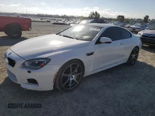 2014 BMW M6 z VIN WBSLX9C51ED160143, wystawiony jako Copart lot #50762185 z przebiegiem 91 718 mil mil oraz Szkody całkowita. Historia ofert i sprzedaży dostępna na DreamBid. Obrazek 1.