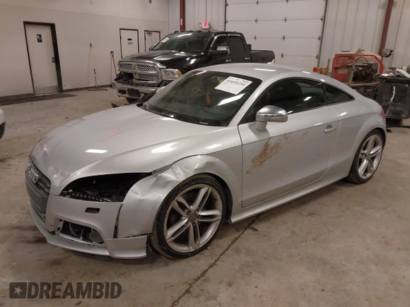 2015 Audi TTS 2.0T z VIN TRUB1AFK2F1000143, wystawiony jako IAAI lot #41649250 z przebiegiem 110 321 mil mil oraz . Historia ofert i sprzedaży dostępna na DreamBid. Obrazek 2.