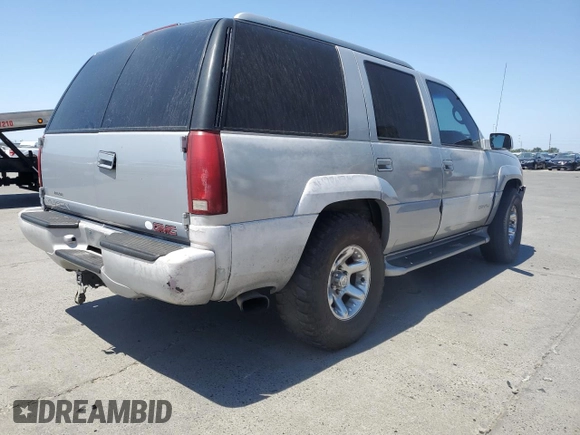 1999 GMC Denali z VIN 1GKEK13R6XR914411, wystawiony jako Copart lot #56063555 z przebiegiem 231 344 mil mil oraz Szkoda całkowita • Salvage title. Historia ofert i sprzedaży dostępna na DreamBid. Obrazek 3.