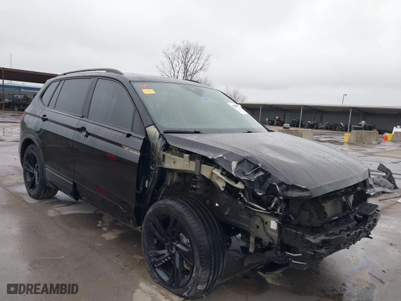 2023 Volkswagen Tiguan SE R-Line Black with VIN 3VVCB7AX0PM061742, listed as a IAAI auction lot 41528630 with 22,571 mi miles. Bid and sale history available at carsss.com. Image 1.