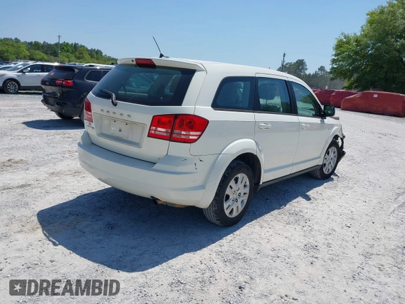 2015 Dodge Journey SE z VIN 3C4PDCAB7FT572716, wystawiony jako IAAI lot #42010091 z przebiegiem 186 489 mil mil oraz . Historia ofert i sprzedaży dostępna na DreamBid. Obrazek 4.