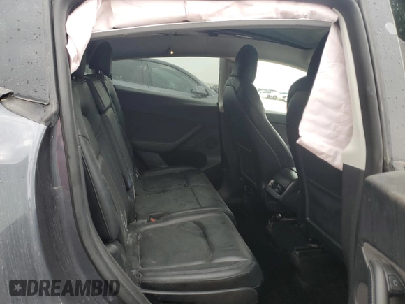 2022 Tesla Model Y Long Range z VIN 7SAYGAEE4NF543503, wystawiony jako Copart lot #47143155 z przebiegiem 53 874 mil mil oraz Szkody całkowita. Historia ofert i sprzedaży dostępna na DreamBid. Obrazek 11.