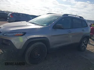 2015 Jeep Cherokee Trailhawk with VIN 1C4PJMBS3FW662307, listed as a IAAI auction lot 41778932 with 64,569 mi miles. Bid and sale history available at carsss.com. Image 14.