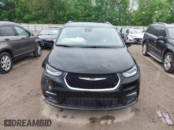 2022 Chrysler Pacifica Touring L with VIN 2C4RC1BG3NR106311, listed as a IAAI auction lot 42158651 with 68,473 mi miles and . Bid and sale history available at DreamBid. Image 13.