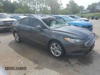 2018 Ford Fusion SE z VIN 3FA6P0H78JR261102, wystawiony jako Copart lot #69963883 z przebiegiem 120 068 mil mil oraz Czysty tytuł • Clean title. Historia ofert i sprzedaży dostępna na DreamBid. Obrazek 4.