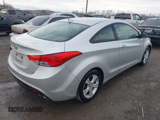 2013 Hyundai Elantra Coupe SE with VIN KMHDH6AE8DU011104, listed as a IAAI auction lot 41588963 with 112,726 mi miles. Bid and sale history available at carsss.com. Image 4.