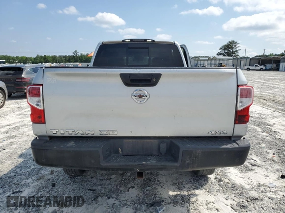 2020 Nissan Titan SV z VIN 1N6AA1FA3LN511567, wystawiony jako Copart lot #54921955 z przebiegiem 74 002 mil mil oraz Szkoda całkowita • Salvage title. Historia ofert i sprzedaży dostępna na DreamBid. Obrazek 6.