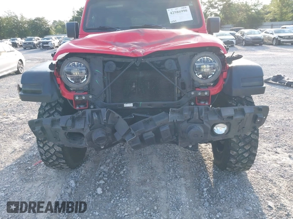 2020 Jeep Wrangler Unlimited Willys z VIN 1C4HJXDM1LW290451, wystawiony jako IAAI lot #42586990 z przebiegiem 64 163 mil mil oraz . Historia ofert i sprzedaży dostępna na DreamBid. Obrazek 6.