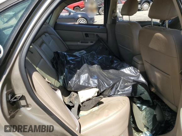 2003 Ford Taurus SEL Deluxe with VIN 1FAHP56SX3G199970, listed as a Copart auction lot 53042795 with 212,802 mi miles and Salvage Title. Bid and sale history available at DreamBid. Image 11.