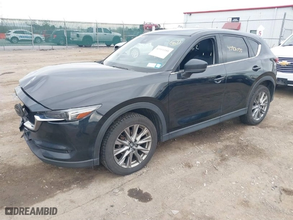 2021 Mazda CX-5 Grand Touring with VIN JM3KFBDMXM0456939, listed as a IAAI auction lot 40901055 with 113,540 mi miles. Bid and sale history available at carsss.com. Image 2.