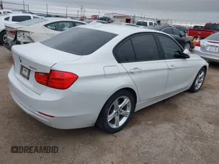 2015 BMW 3 Series 320i with VIN WBA3B1C5XFK140734, listed as a IAAI auction lot 42141319 with 84,863 mi miles and . Bid and sale history available at DreamBid. Image 4.