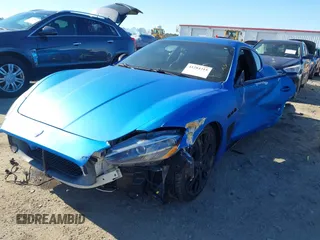 2013 Maserati GranTurismo Sport with VIN ZAM45VLA5D0070499, listed as a IAAI auction lot 41284315 with 50,156 mi miles. Bid and sale history available at carsss.com. Image 2.