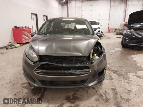 2015 Ford Fiesta SE z VIN 3FADP4EJ8FM138306, wystawiony jako IAAI lot #41227124 z przebiegiem 106 741 mil mil oraz . Historia ofert i sprzedaży dostępna na DreamBid. Obrazek 12.