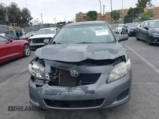 2009 Toyota Corolla with VIN JTDBL40E899066243, listed as a IAAI auction lot 41884292 with 219,338 mi miles. Bid and sale history available at carsss.com. Image 12.