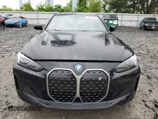 2024 BMW i4 eDrive35 with VIN WBY43AW05RFS84773, listed as a Copart auction lot 54974024 with 2,942 mi miles and Salvage Title. Bid and sale history available at carsss.com. Image 5.