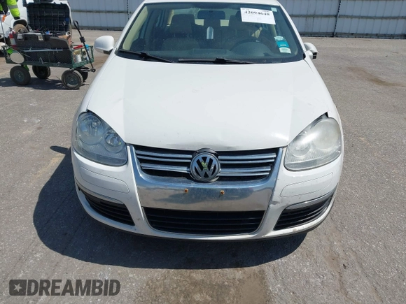 2009 Volkswagen Jetta SE z VIN 3VWRM71K99M057390, wystawiony jako IAAI lot #42094648 z przebiegiem 168 533 mil mil oraz . Historia ofert i sprzedaży dostępna na DreamBid. Obrazek 13.