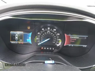 2020 Ford Fusion SE z VIN 3FA6P0T97LR234873, wystawiony jako IAAI lot #41510333 z przebiegiem 65 243 mil mil oraz . Historia ofert i sprzedaży dostępna na DreamBid. Obrazek 7.