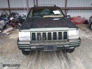 1997 Jeep Grand Cherokee Limited with VIN 1J4GZ78Y5VC723429, listed as a IAAI auction lot 42012836 with 231,126 mi miles. Bid and sale history available at carsss.com. Image 12.