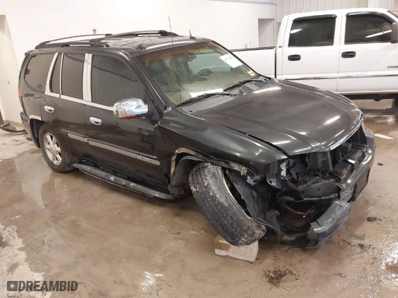2004 GMC Envoy SLE with VIN 1GKDT13S642381802, listed as a IAAI auction lot 41723854 with 212,283 mi miles. Bid and sale history available at carsss.com. Image 1.