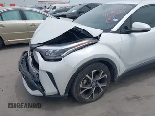 2022 Toyota C-HR XLE z VIN NMTKHMBX2NR144638, wystawiony jako IAAI lot #42063325 z przebiegiem 22 823 mil mil oraz . Historia ofert i sprzedaży dostępna na DreamBid. Obrazek 6.