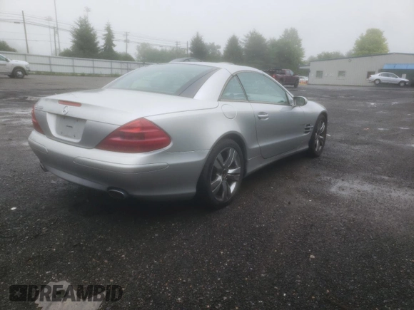 2005 Mercedes-Benz SL 500 with VIN WDBSK75F05F094991, listed as a Copart auction lot 61678705 with 128,123 mi miles and Clean title. Bid and sale history available at DreamBid. Image 3.