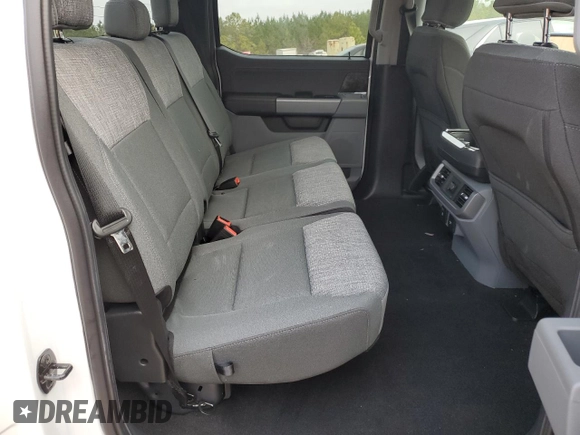 2023 Ford F-150 Lightning Pro z VIN 1FTVW1ELXPWG63466, wystawiony jako Copart lot #43397005 z przebiegiem 8 852 mil mil oraz Szkoda całkowita • Salvage title. Historia ofert i sprzedaży dostępna na DreamBid. Obrazek 10.
