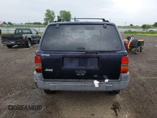 1998 Jeep Grand Cherokee Laredo with VIN 1J4GZ58SXWC144437, listed as a Copart auction lot 60437094 with 183,908 mi miles and Salvage Title. Bid and sale history available at carsss.com. Image 6.