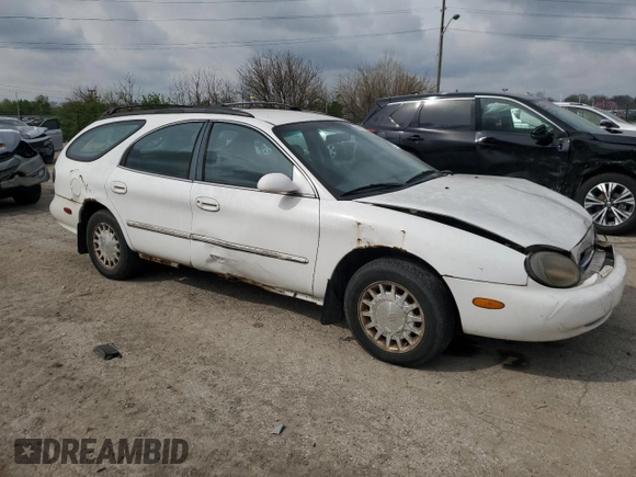 1999 Mercury Sable z VIN 1MEFM58U7XA652331, wystawiony jako Copart lot #49919194 z przebiegiem 143 835 mil mil oraz Szkoda całkowita • Salvage title. Historia ofert i sprzedaży dostępna na DreamBid. Obrazek 4.