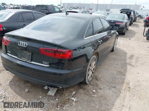 2016 Audi A6 2.0T Premium Plus with VIN WAUGFAFC1GN012799, listed as a IAAI auction lot 42141346 with 101,506 mi miles. Bid and sale history available at carsss.com. Image 4.