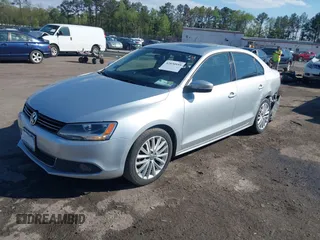 2014 Volkswagen Jetta TDI w/Premium with VIN 3VWLL7AJ2EM359341, listed as a IAAI auction lot 42030959 with 74,273 mi miles and . Bid and sale history available at DreamBid. Image 2.