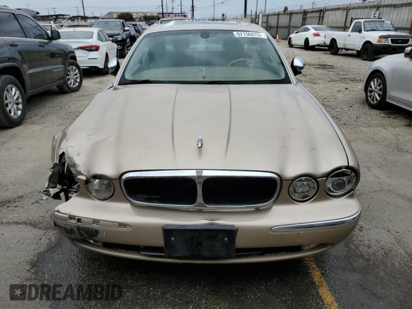 2004 Jaguar XJ with VIN SAJEA74C84SG03857, listed as a Copart auction lot 62156875 with 92,649 mi miles and Salvage title. Bid and sale history available at DreamBid. Image 5.