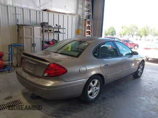 2003 Ford Taurus SE Standard with VIN 1FAFP53U13G229161, listed as a IAAI auction lot 39753697 with 94,195 mi miles. Bid and sale history available at carsss.com. Image 4.