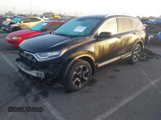 2019 Honda CR-V Touring with VIN 7FARW2H9XKE012394, listed as a IAAI auction lot 41092564 with 49,527 mi miles and . Bid and sale history available at DreamBid. Image 2.